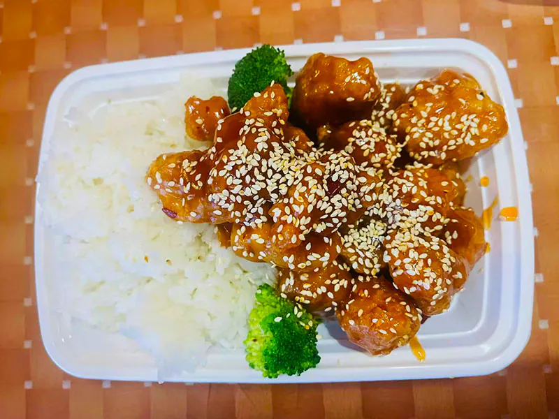 Sesame-topped chicken served with fluffy white rice at Asian Cuisine, a Chinese Restaurant in Kutztown